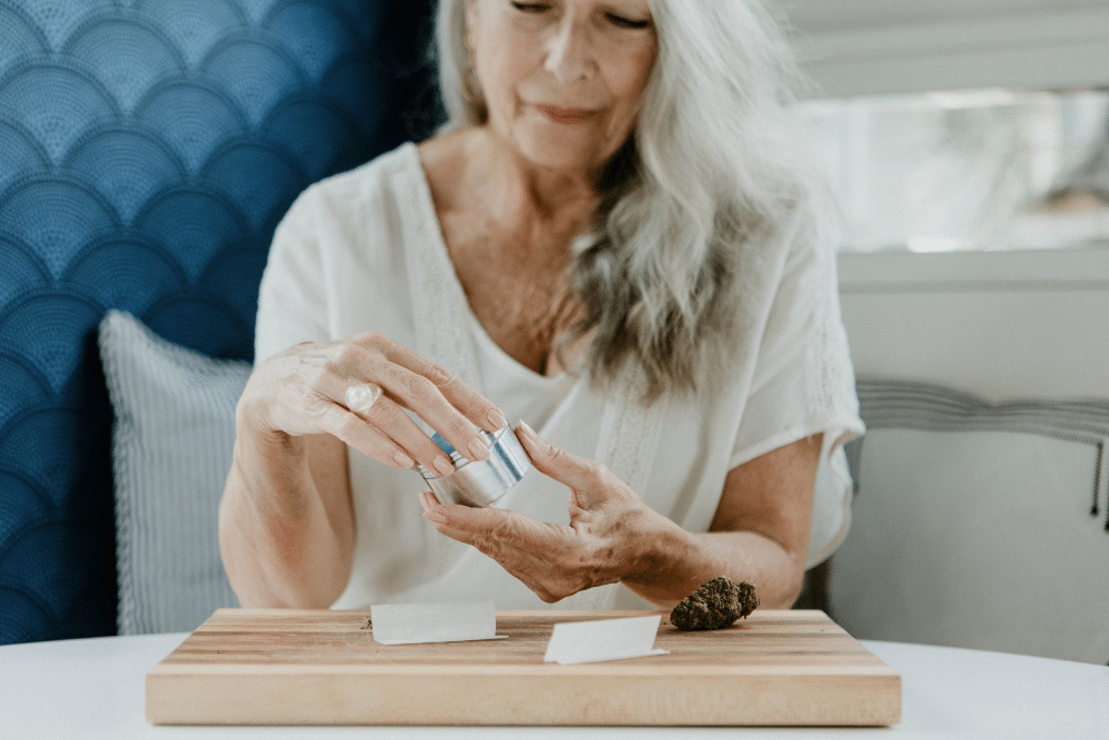 woman rolling blunt flower