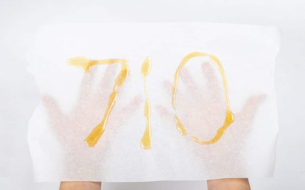 710 spelled in cannabis concentrate on parchment paper